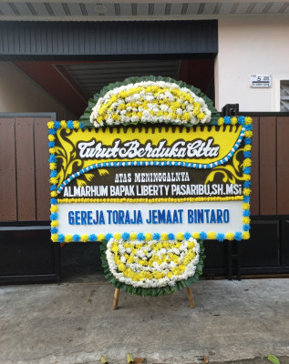 Papan Bunga Duka di Ginanjar